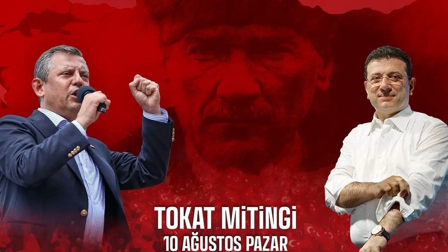 A man holding a microphone and another man raising his hands at the rally. A man holding a microphone and another man raising his hands at the rally.
