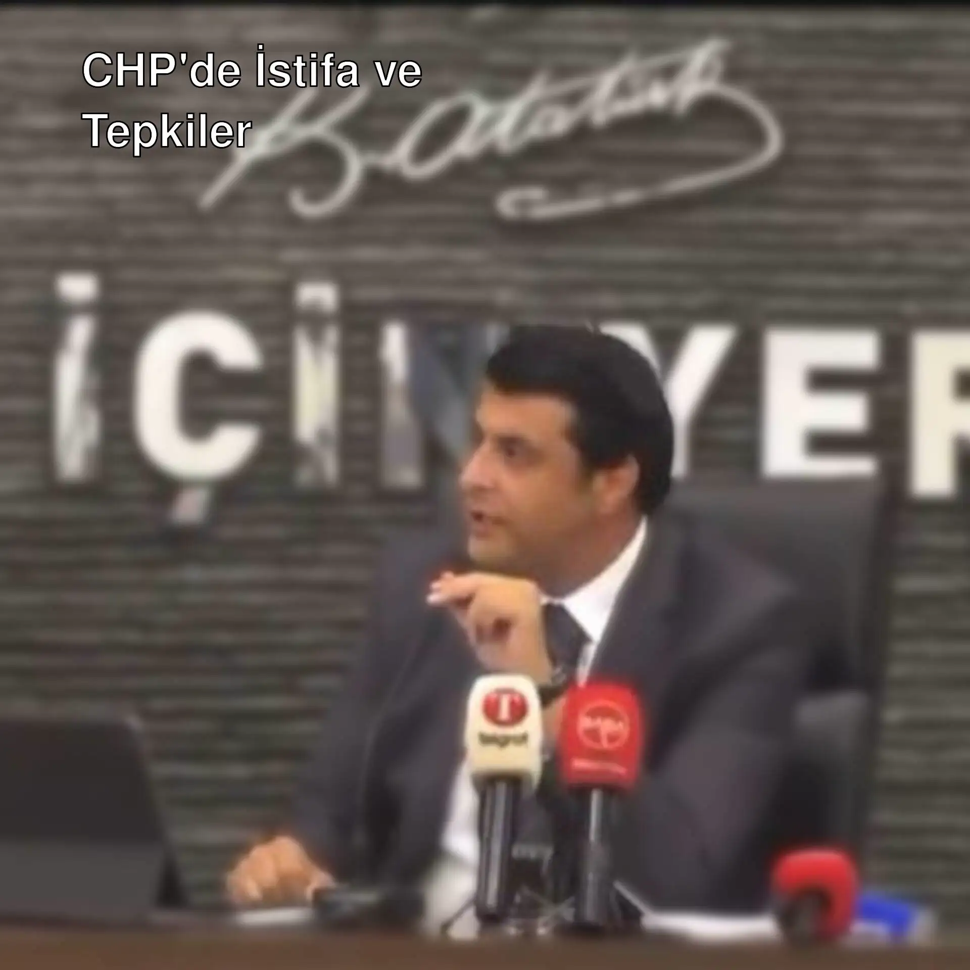 Ali Güdücü, meclis kürsüsünde konuşma yaparken.