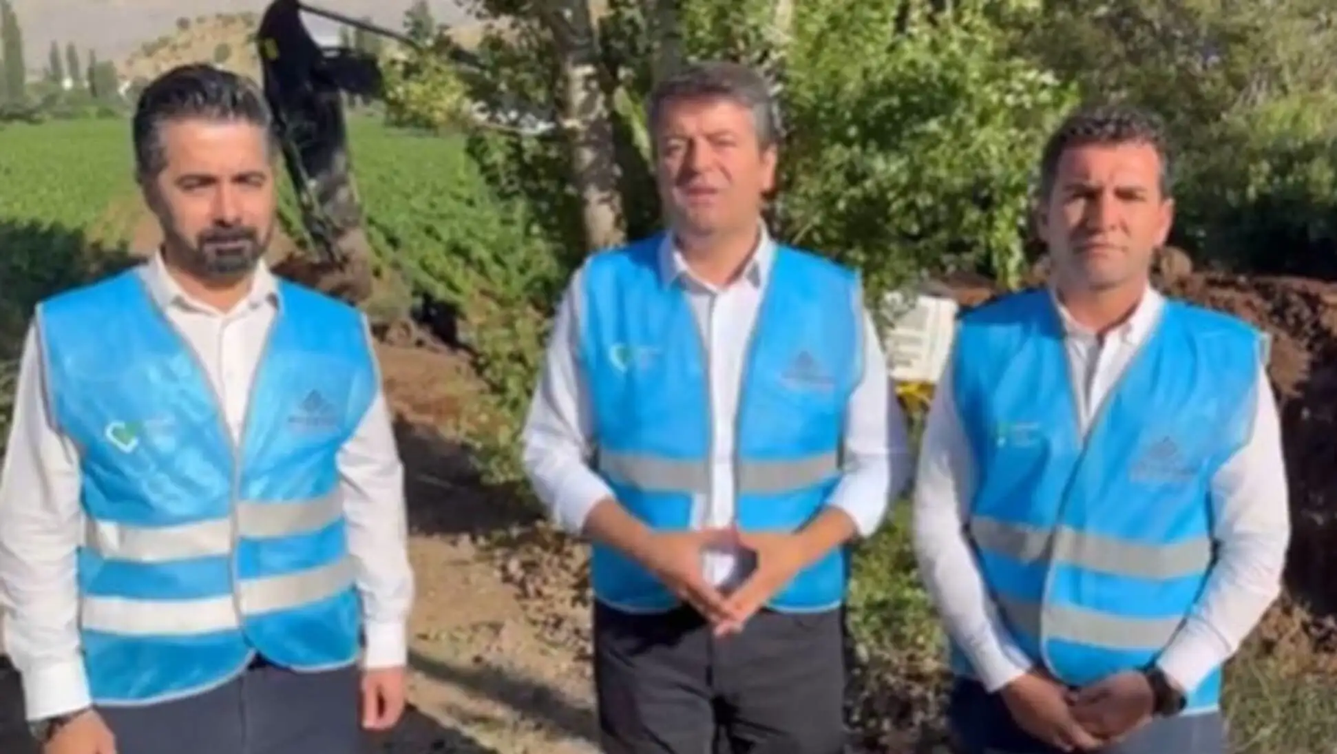 A group of men wearing vests A group of men wearing vests