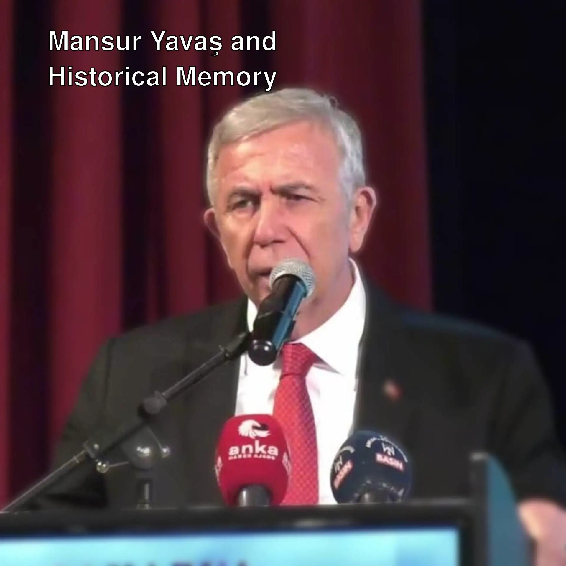 Mansur Yavaş speaking into a microphone. Mansur Yavaş speaking into a microphone.