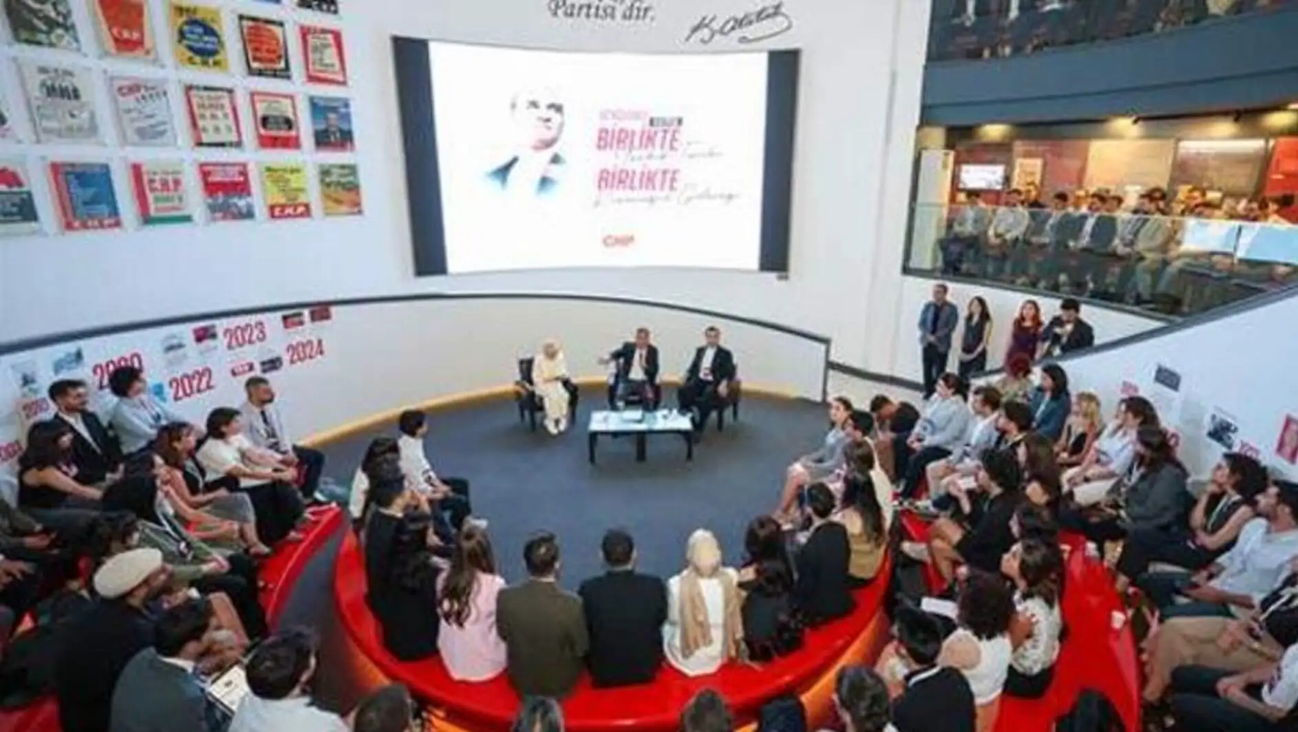 A group of people sitting in a circle.