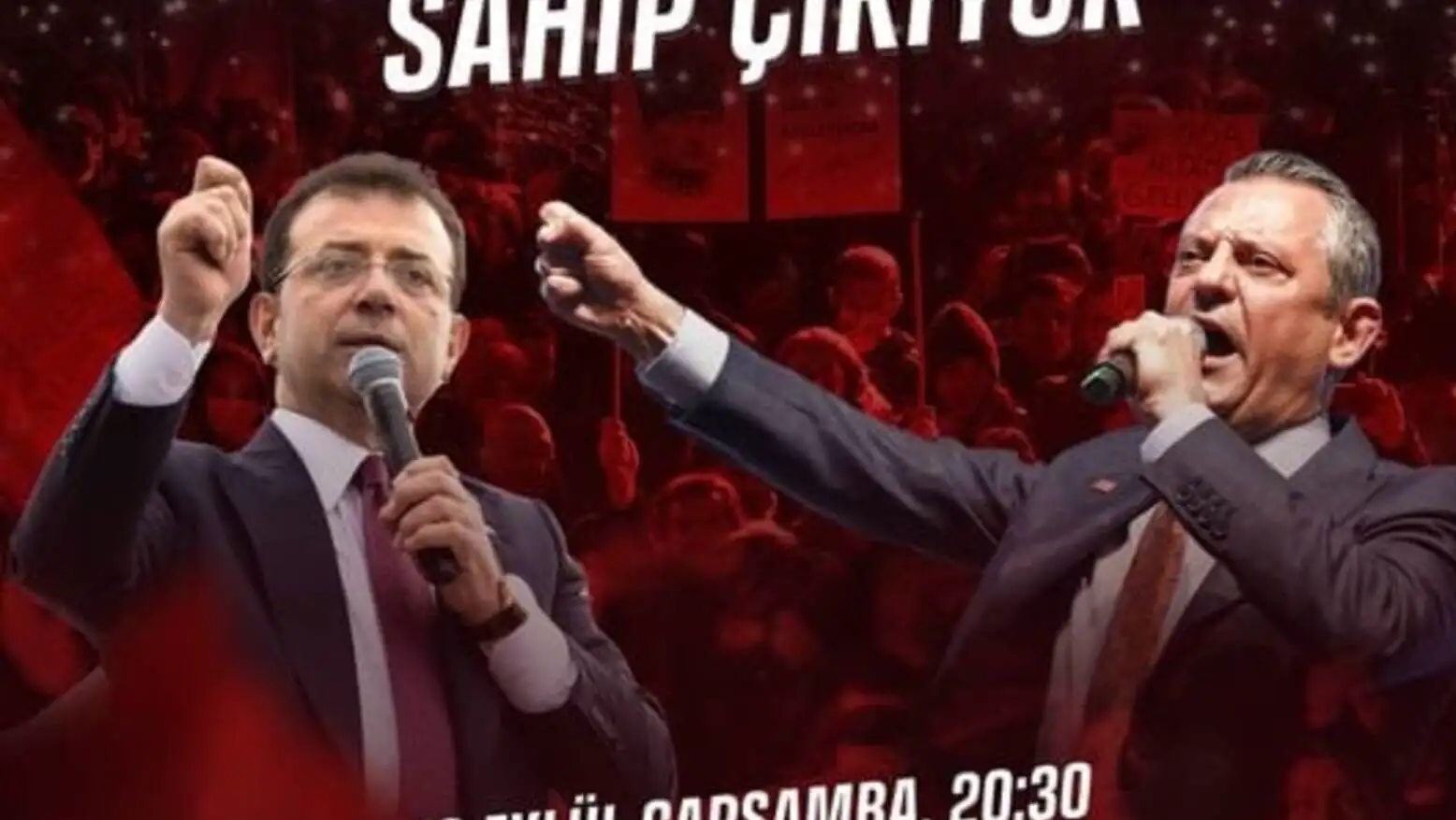 Two men holding microphones in front of a crowd. Two men holding microphones in front of a crowd.