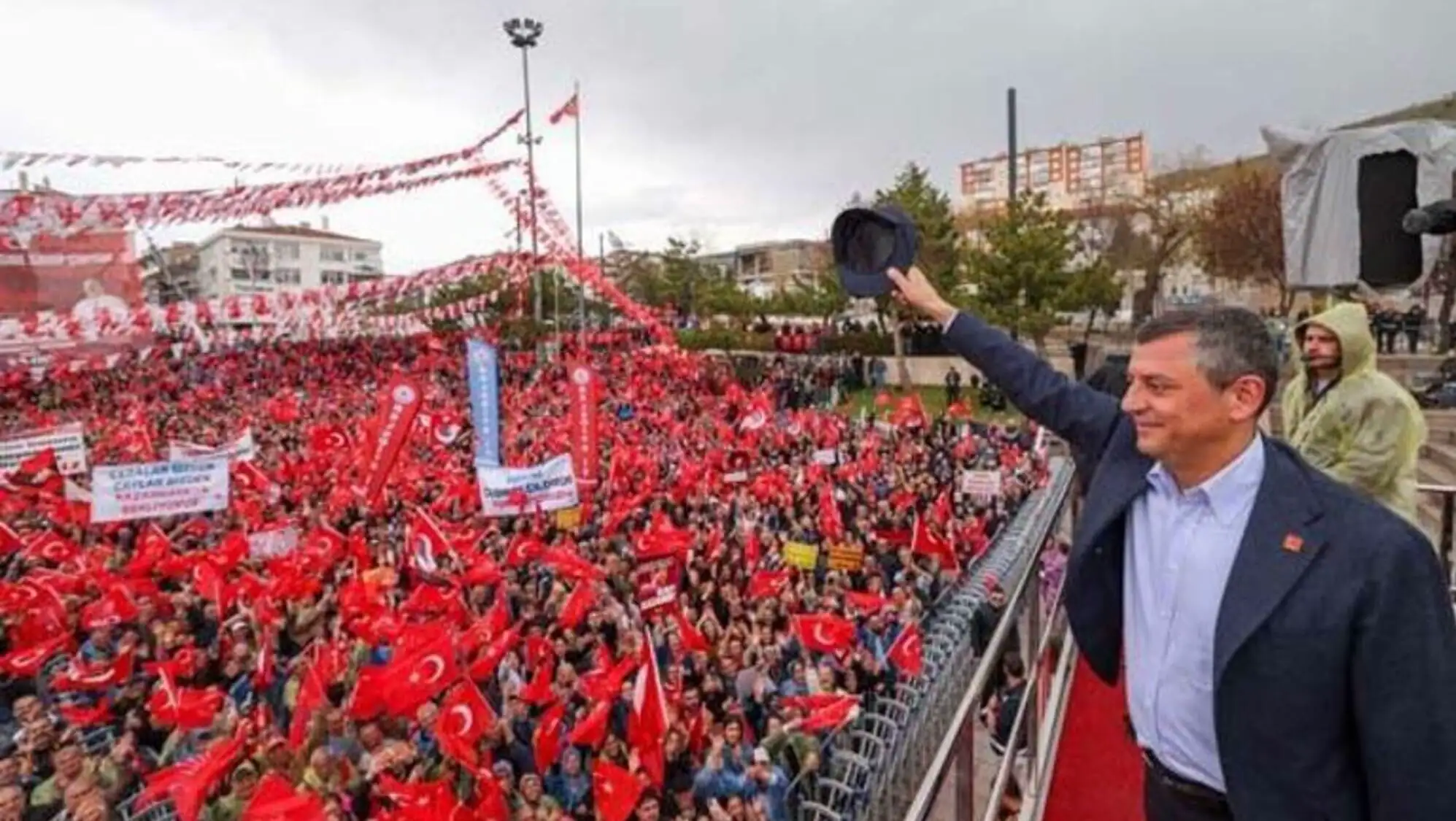 CHP Chairman Özgür Özel addressing a large crowd.