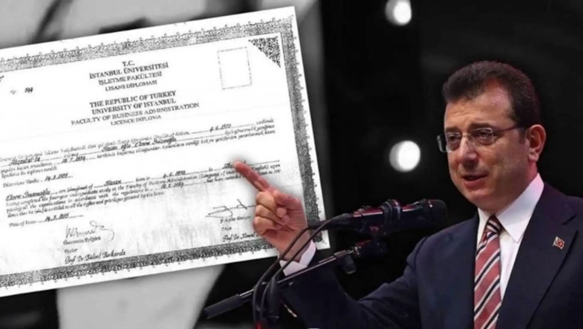 Imamoğlu pointing at a certificate.