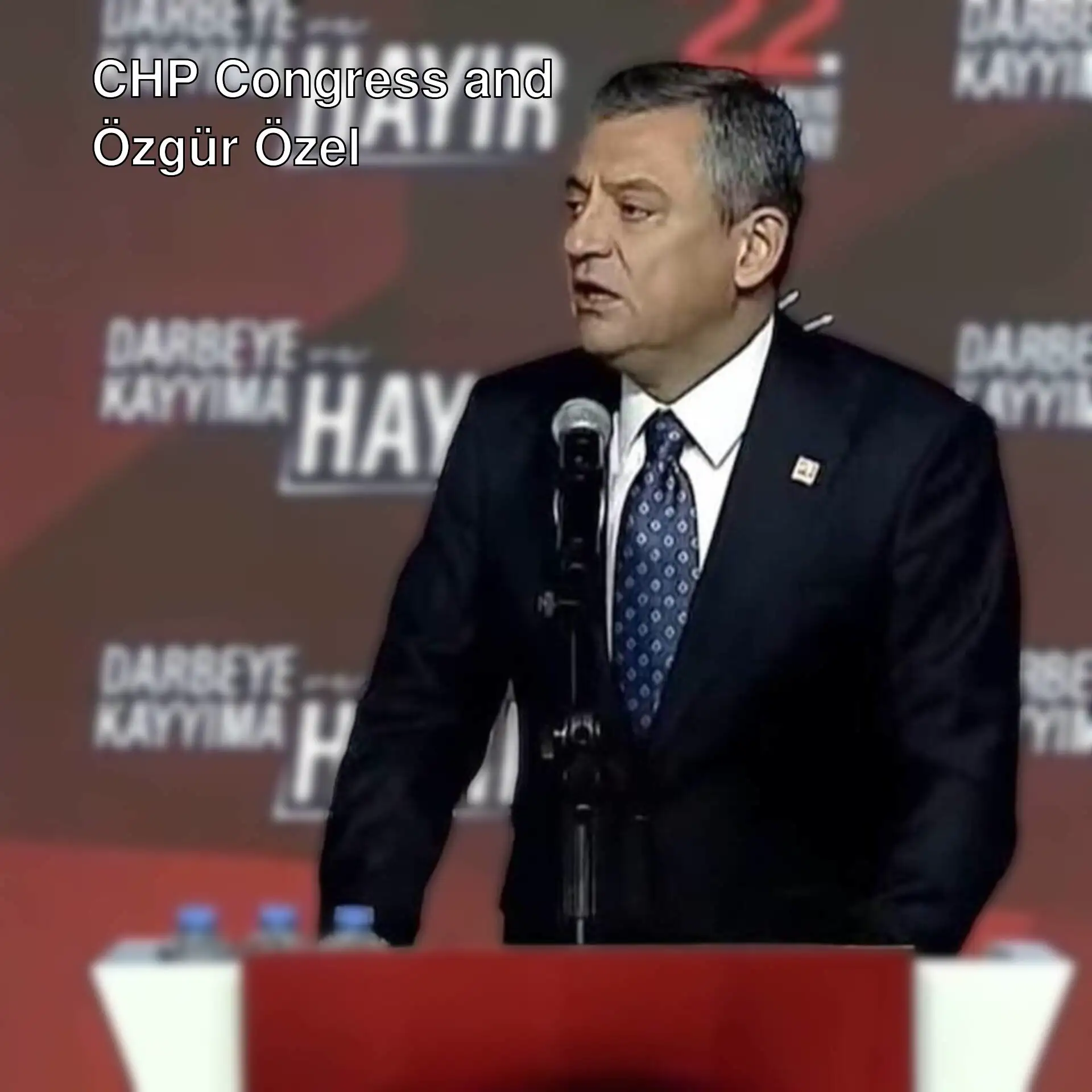 Özgür Özel is giving a speech.