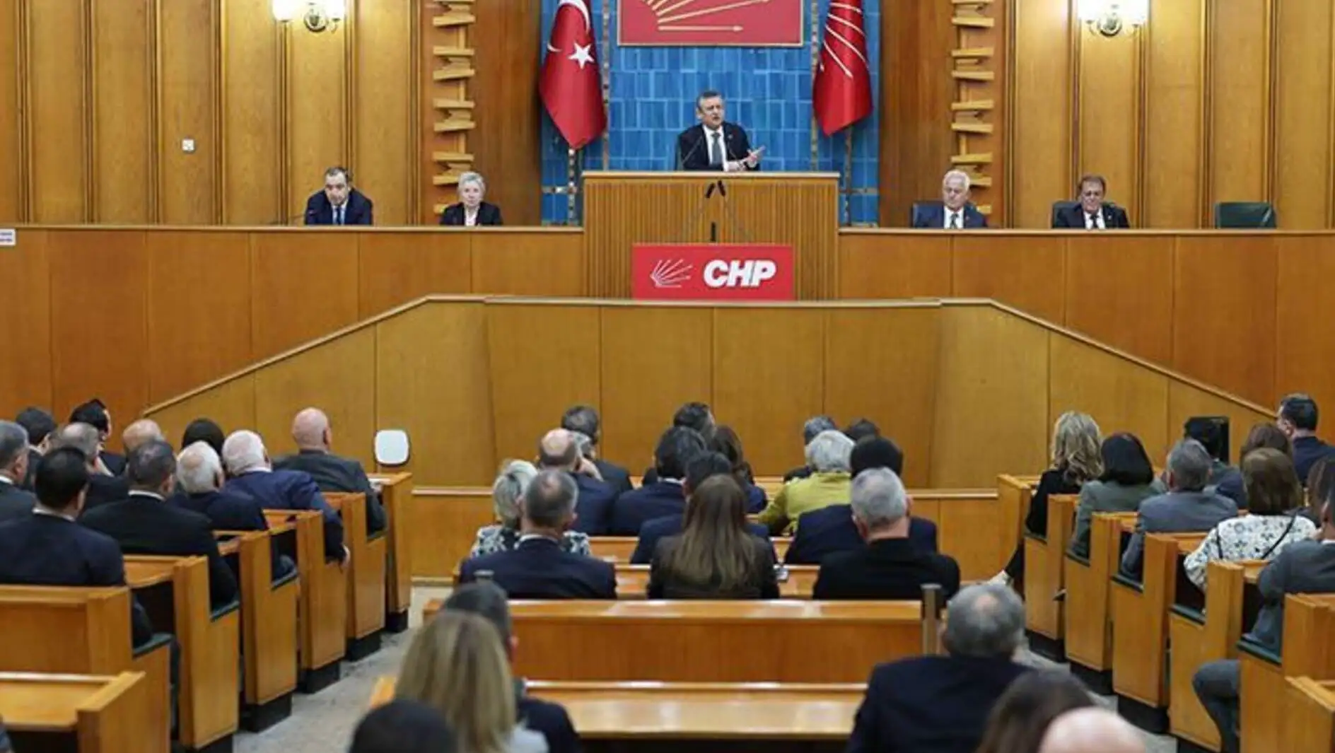 A man speaking in front of a crowd at the congress.