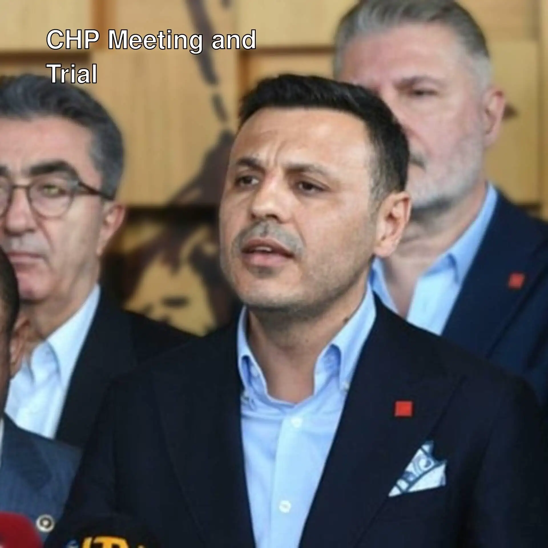 Özgür Çelik speaking at a press conference before the trial.