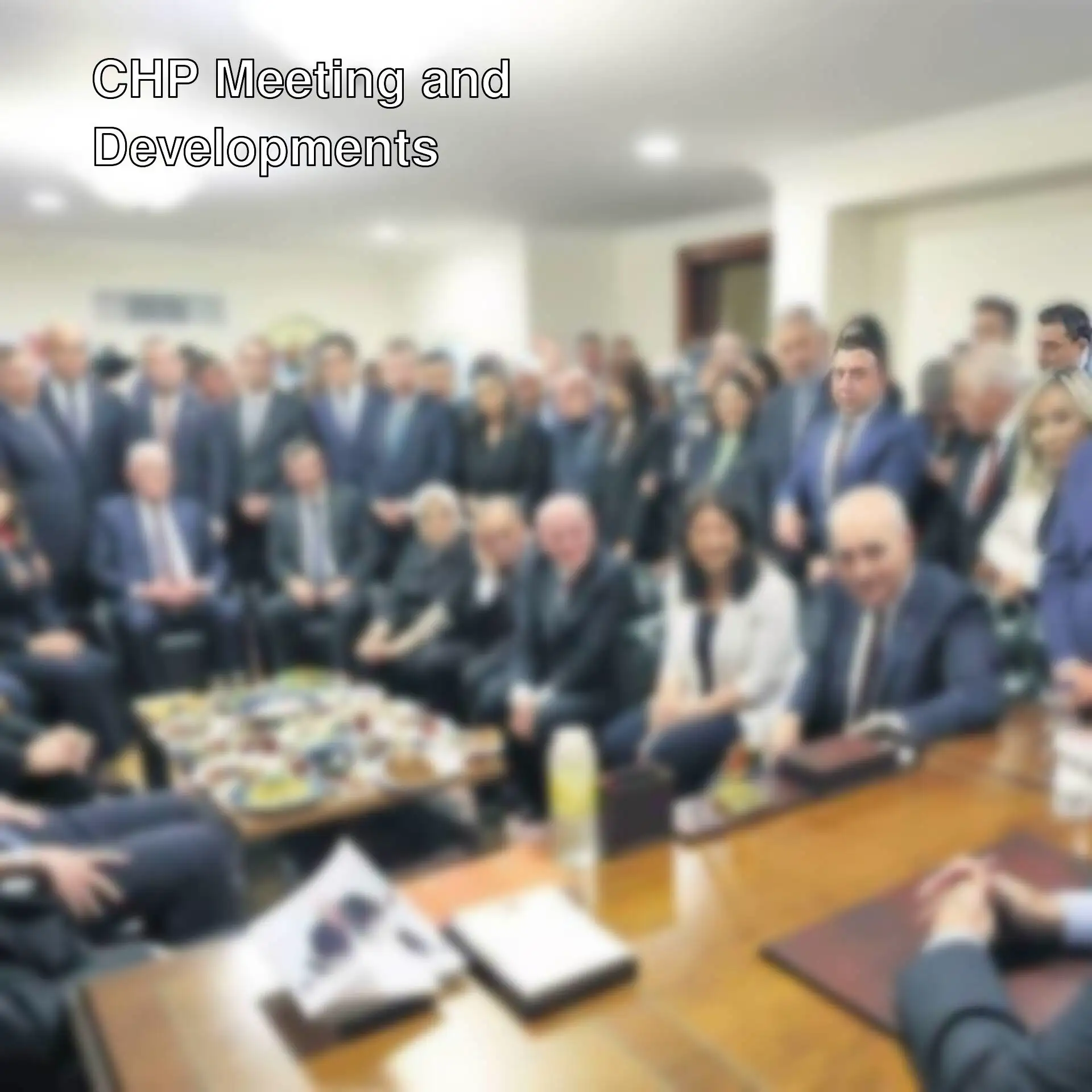 A group of people sitting around a table.