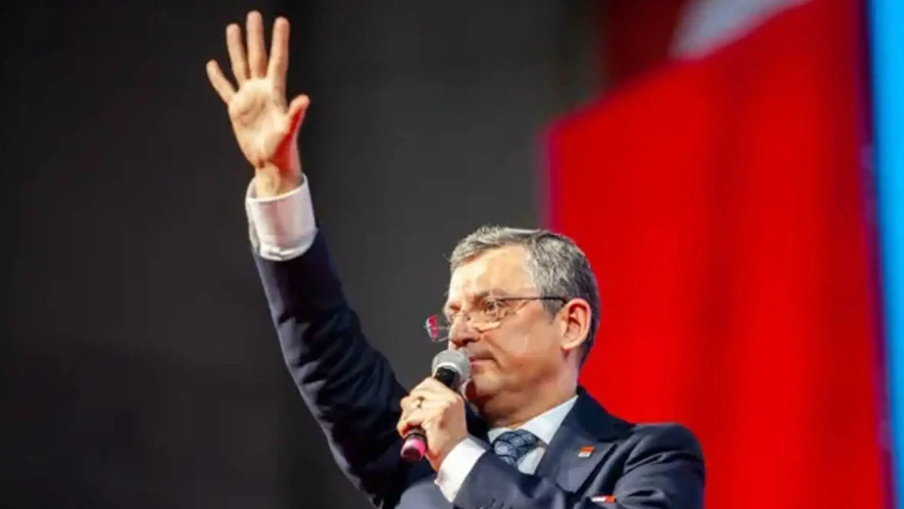 Özgür Özel speaking at a press conference.