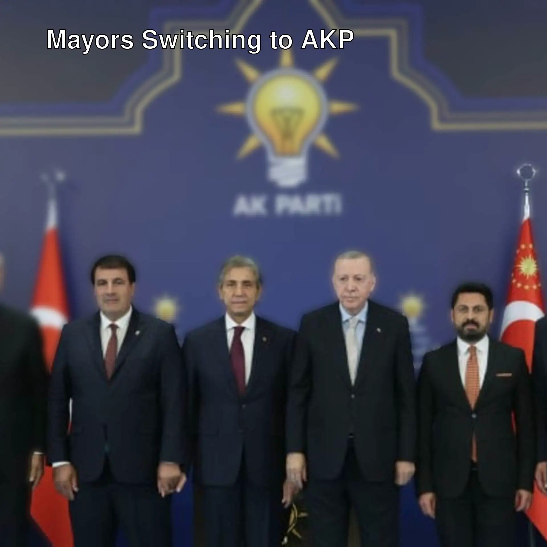 A group of men in suits posing together.