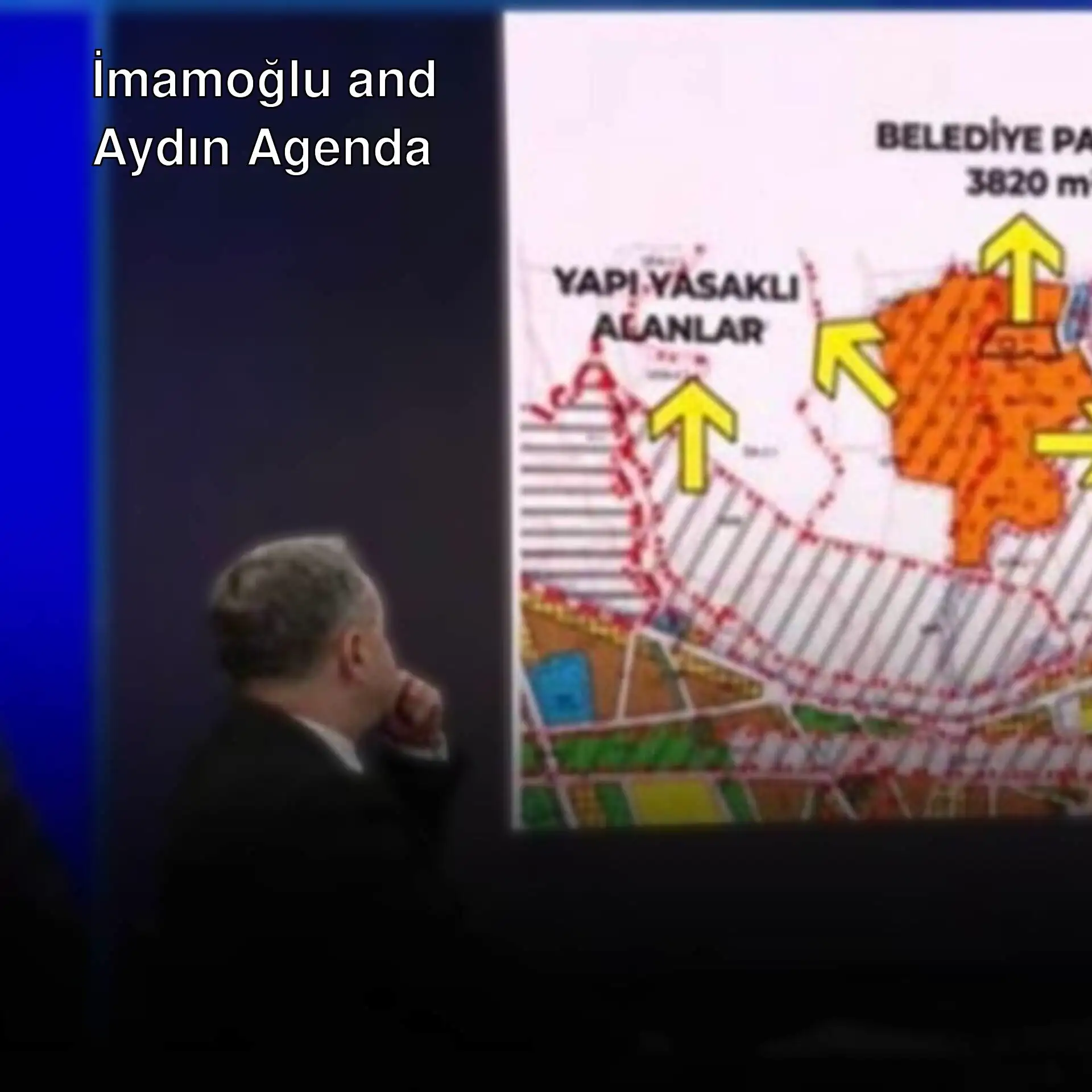 A group of men looking at a map.