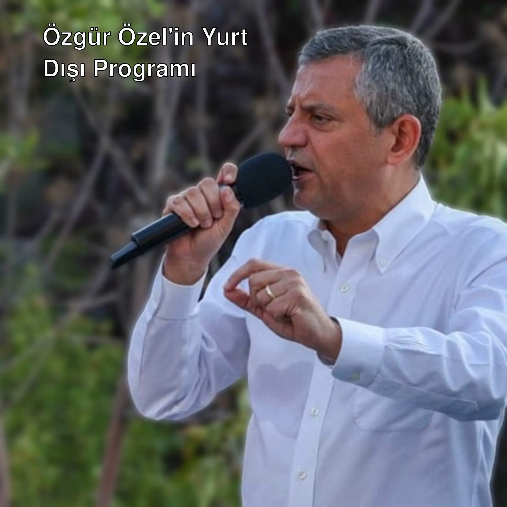 Özgür Özel, mikrofonla konuşuyor.