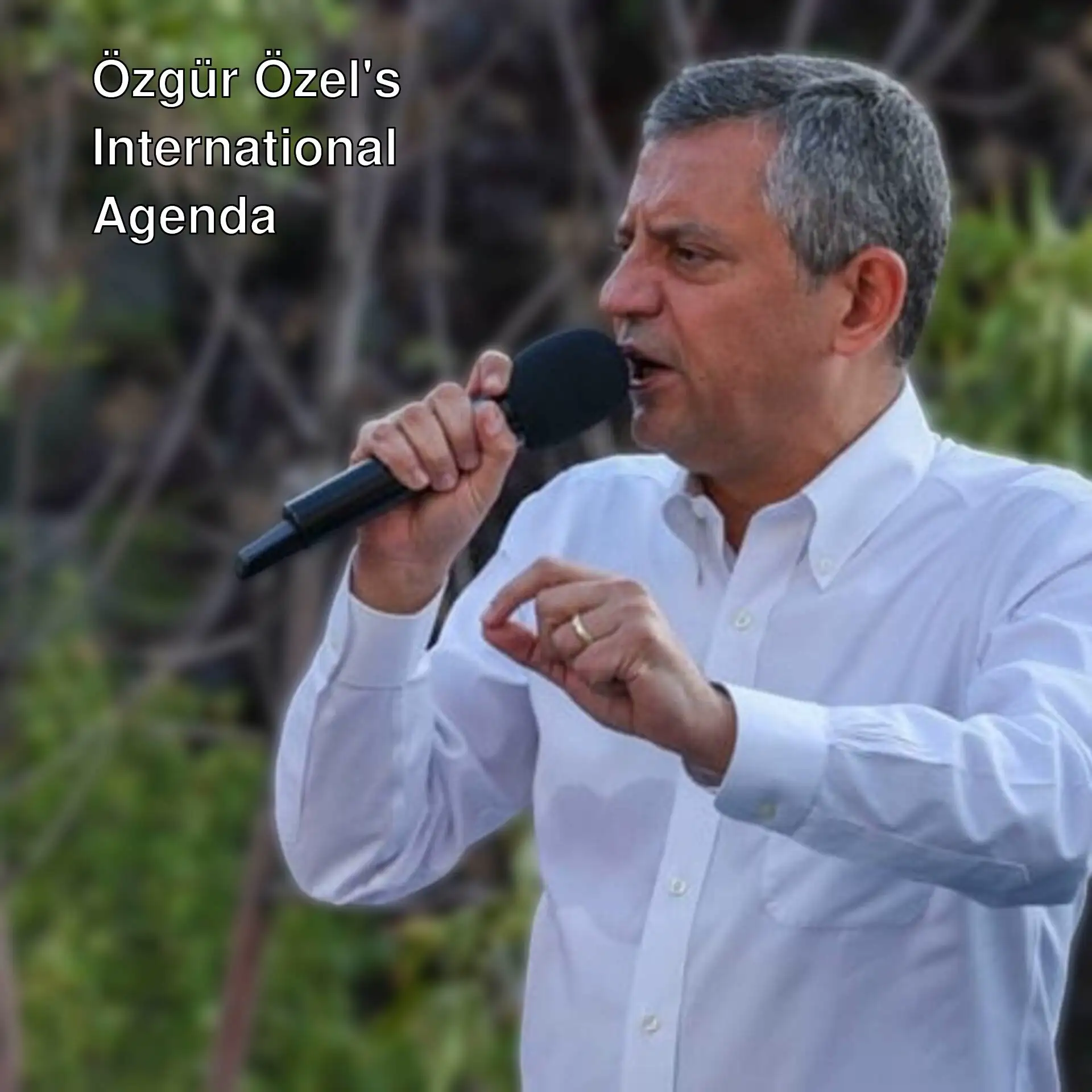 Özgür Özel speaking into a microphone. Özgür Özel speaking into a microphone.