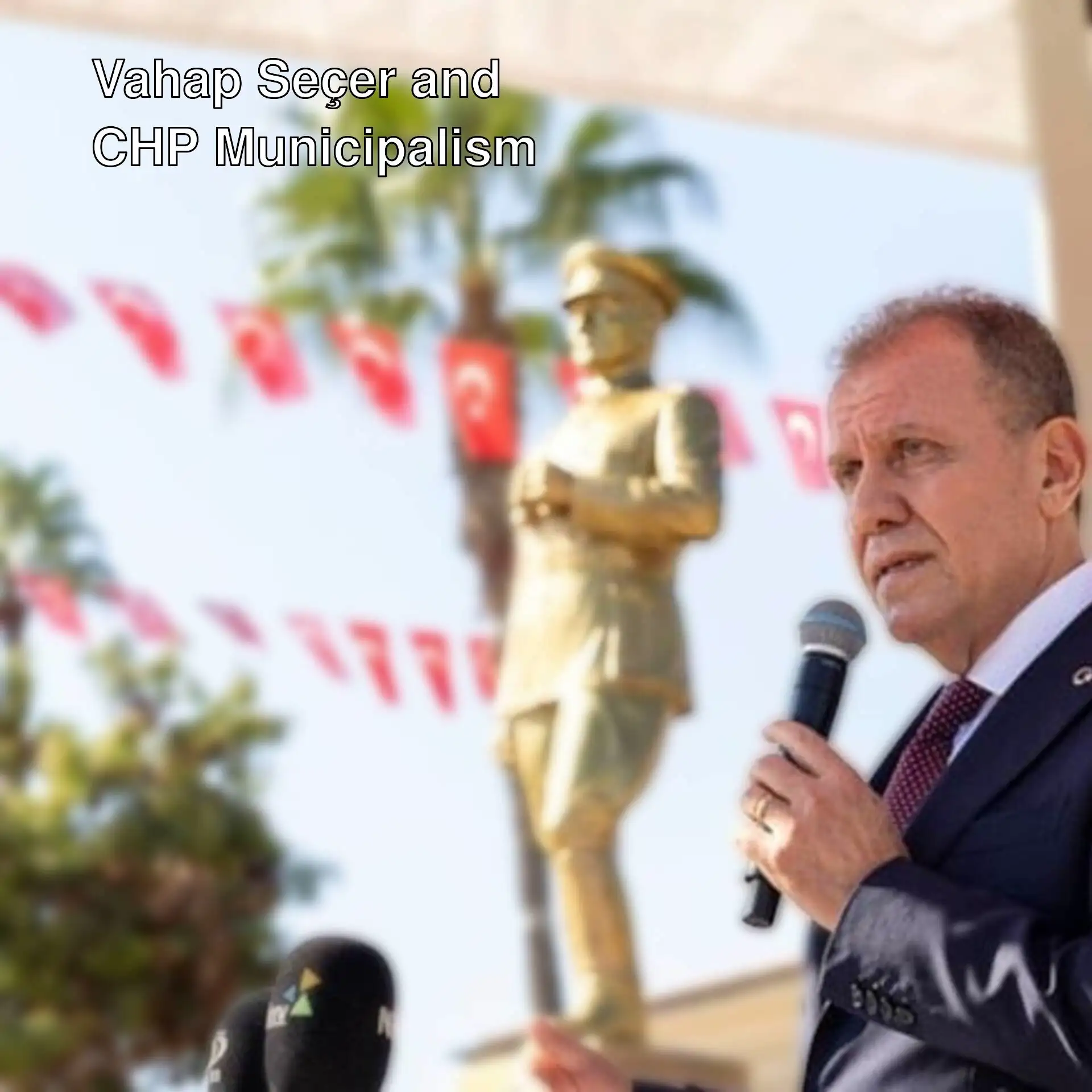 Vahap Seçer speaking into microphones. Vahap Seçer speaking into microphones.