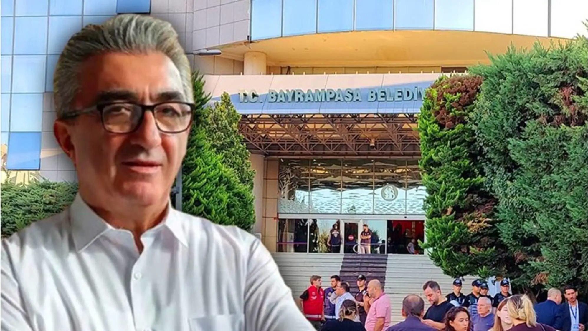 İstanbul'da gözaltına alınan bir adam, bir binanın önünde duruyor.