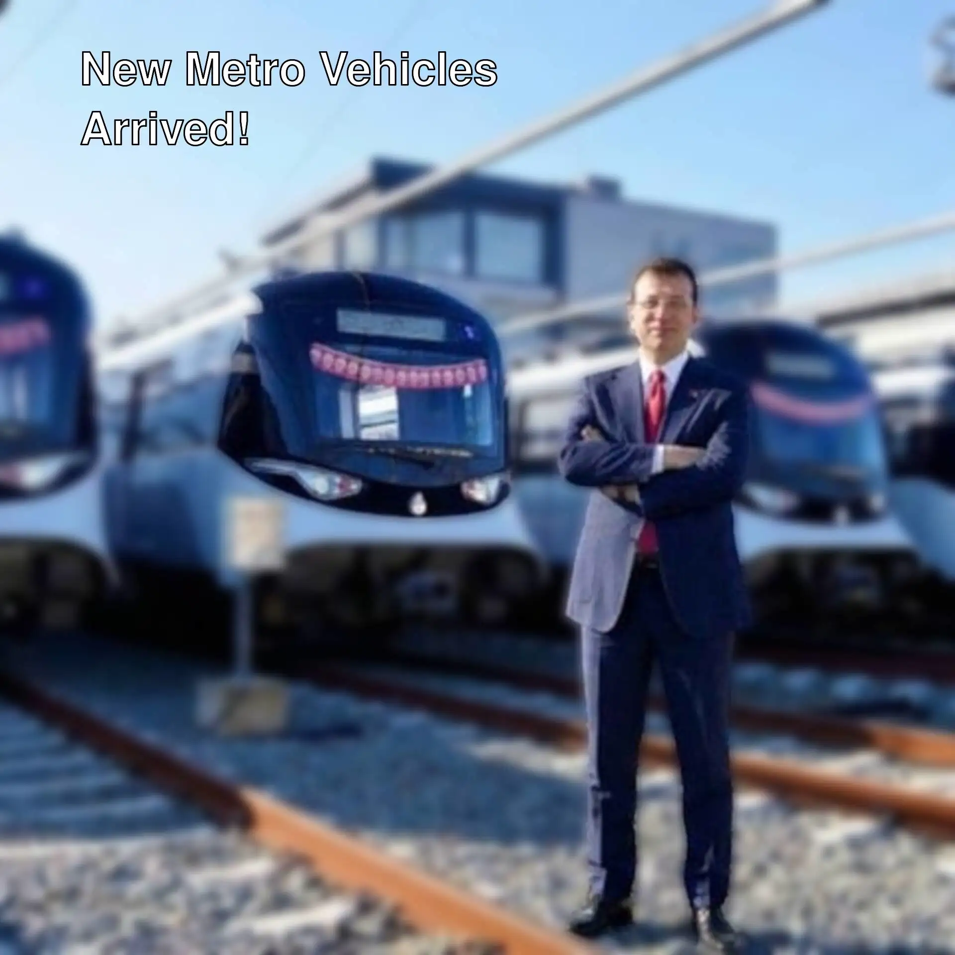 Ekrem İmamoğlu stands in front of new metro vehicles. Ekrem İmamoğlu stands in front of new metro vehicles.